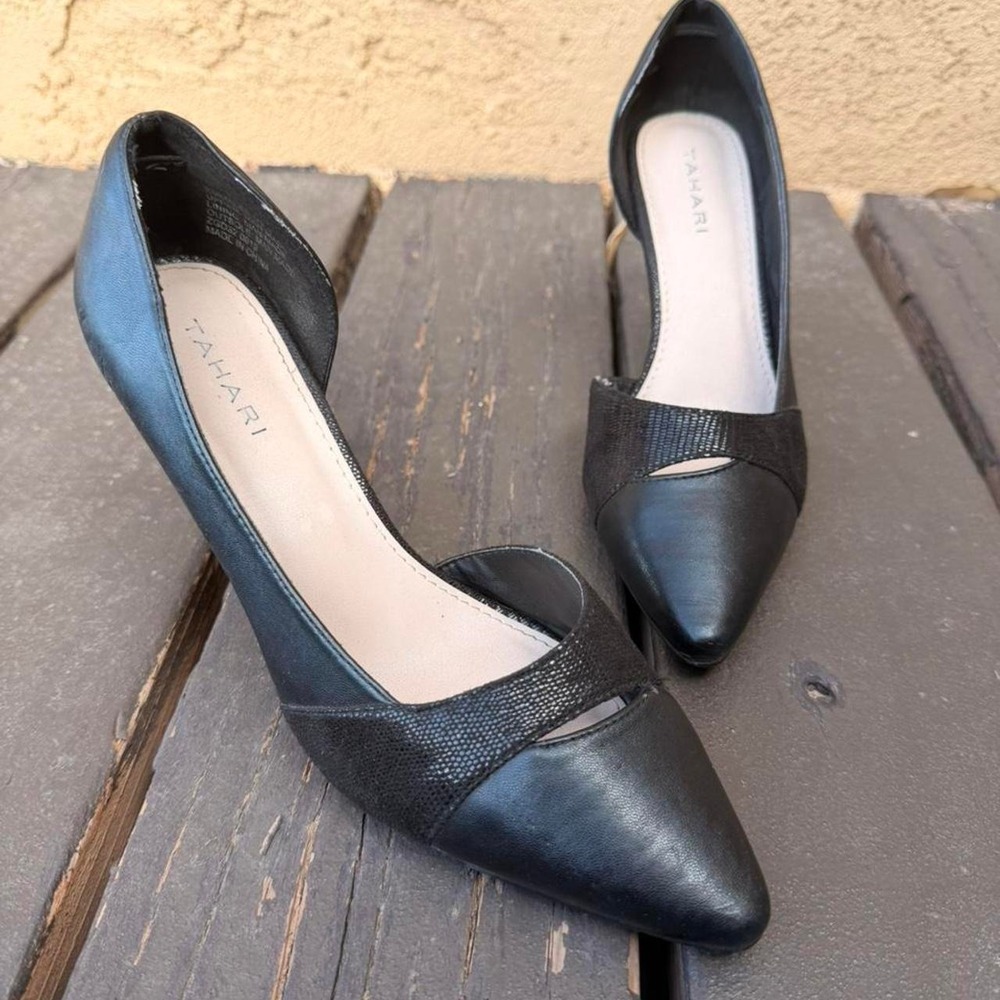 Black Tahari pointed heels.